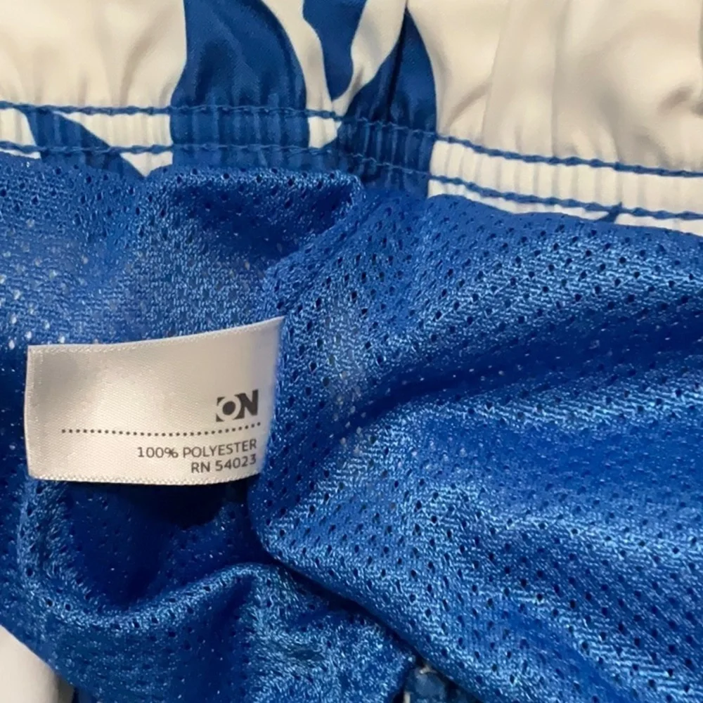 Old Navy blue & white floral swimming trunks. Size XL (40-42)